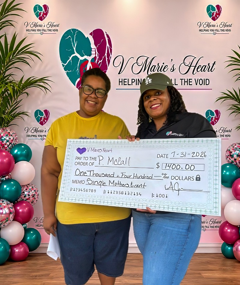 V Marie’s Heart presents a $1,400 Single Mothers Grant to a grant recipient